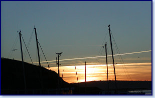 masts at sunset